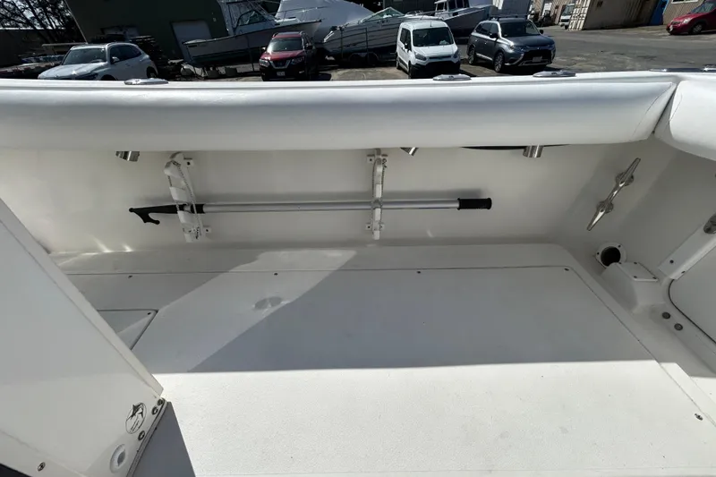 Slide: The Image of 2006 Albin 26 Center Console boat interior with rod holder and storage space. - 36