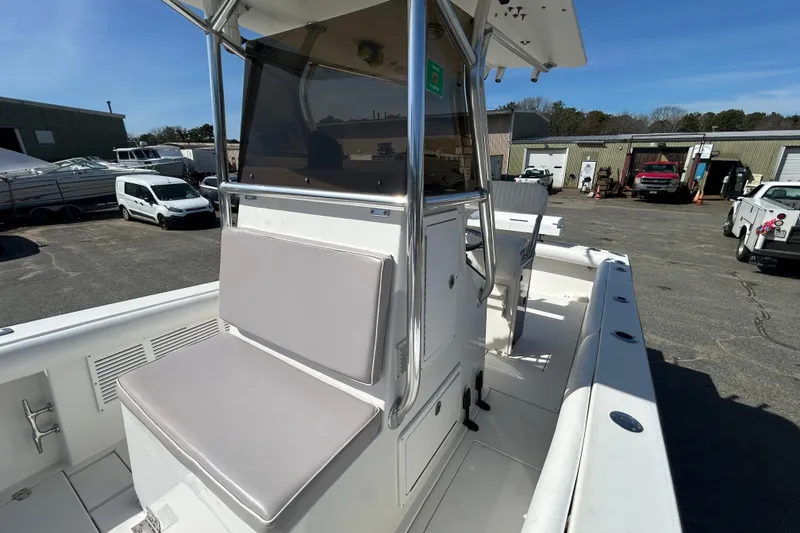 Slide: The Image of 2006 Albin 26 Center Console boat with seating, parked in a marina lot. - 18