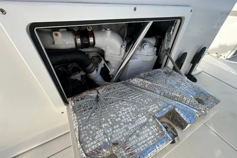 Slide: The Image of Engine compartment of a 2006 Albin 26 Center Console boat, showcasing mechanical components. - 20