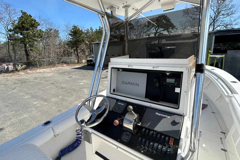 Slide: The Image of 2006 Albin 26 Center Console boat with Garmin navigation system and Raymarine controls. - 15