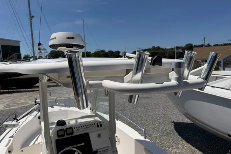 Slide: The Image of 2013 Everglades 210 Center Console boat with rod holders and navigation equipment. - 22