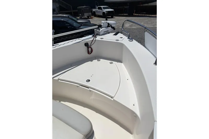 Slide: The Image of 2013 Everglades 210 Center Console boat interior, featuring a clean, spacious deck area. - 15