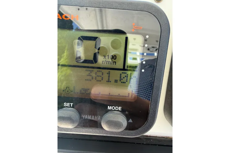 Slide: The Image of Close-up of a Yamaha boat tachometer displaying 381.0 hours on an Everglades 210 Center Console. - 27