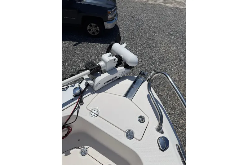 Slide: The Image of 2013 Everglades 210 Center Console boat with Minn Kota trolling motor on deck. - 14