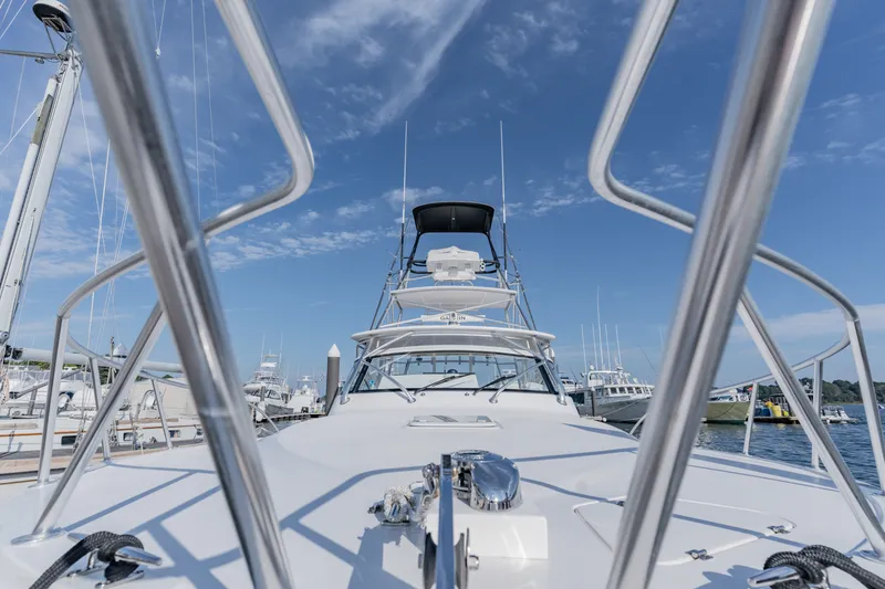 Slide: The Image of 2023 Albemarle 41 Custom Carolina Edition yacht docked under clear blue sky. - 27