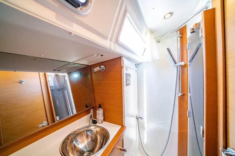 Slide: The Image of Modern bathroom interior of 2021 Jeanneau Sun Odyssey 389 yacht with sleek fixtures. - 5