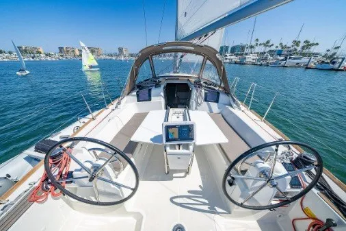 Slide: The Image of Jeanneau Sun Odyssey 389 sailboat, 2021 model, docked in a sunny marina. - 2