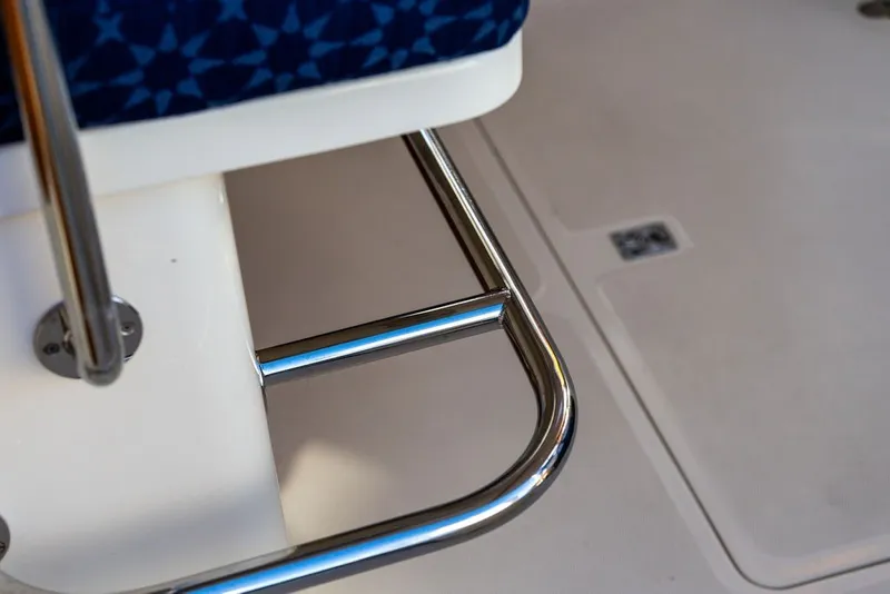 Slide: The Image of Close-up of a 1998 Hinckley Picnic Boat 36 Classic interior with metal railing. - 19