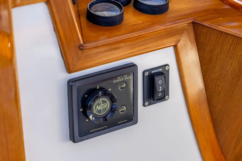 Slide: The Image of Control panel on 1998 Hinckley Picnic Boat 36 Classic with wood trim and navigation instruments. - 36