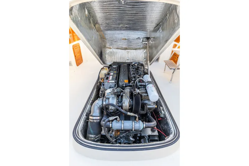 Slide: The Image of Engine compartment of a 1998 Hinckley Picnic Boat 36 Classic, showcasing detailed mechanics. - 55