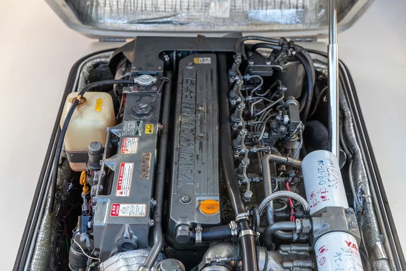 Slide: The Image of Engine of a 1998 Hinckley Picnic Boat 36 Classic, showcasing detailed mechanical components. - 56