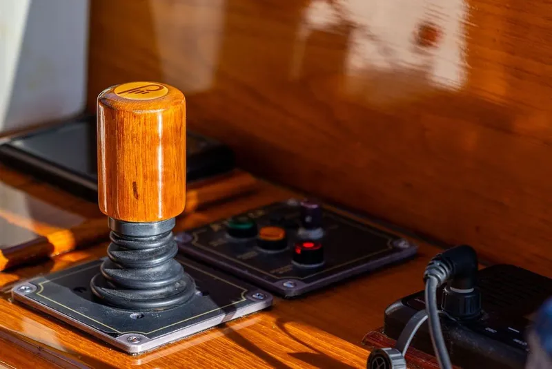 Slide: The Image of Wooden joystick control on 1998 Hinckley Picnic Boat 36 Classic dashboard. - 31