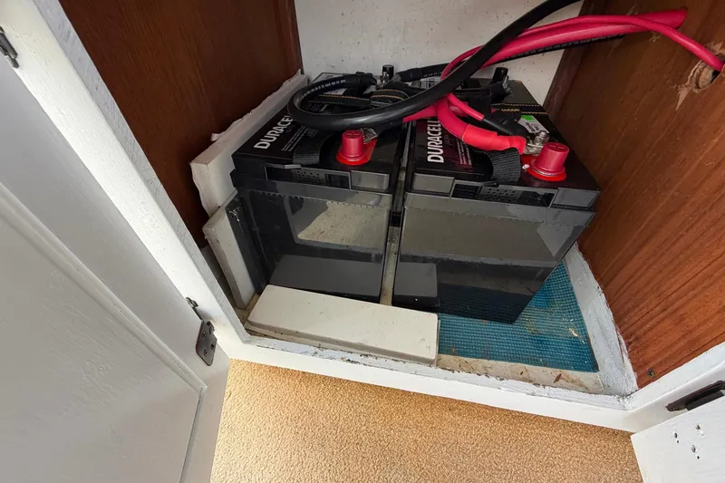 Slide: The Image of Batteries installed in a 1987 Viking 44 Motor Yacht compartment. - 86