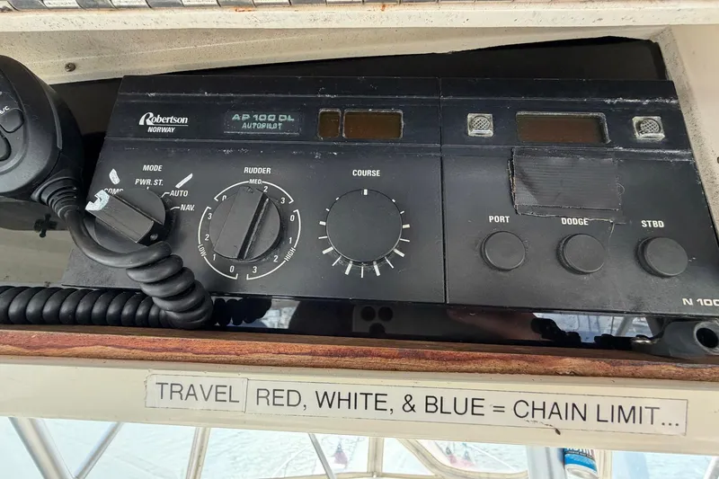 Slide: The Image of Autopilot control panel on 1987 Viking 44 Motor Yacht with microphone and navigation settings. - 69