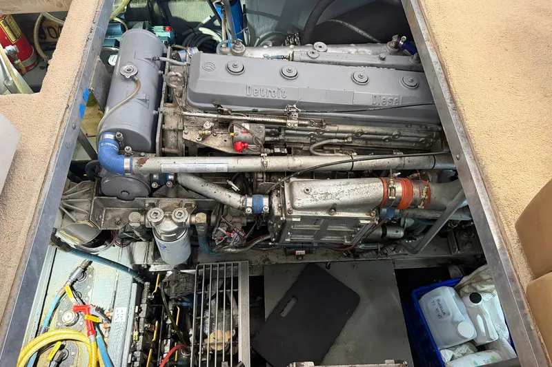 Slide: The Image of Engine compartment of a 1987 Viking 44 Motor Yacht, showcasing detailed mechanical components. - 75