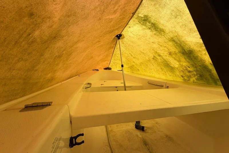 Slide: The Image of Interior view of 1987 Viking 44 Motor Yacht under a yellow tarp. - 90