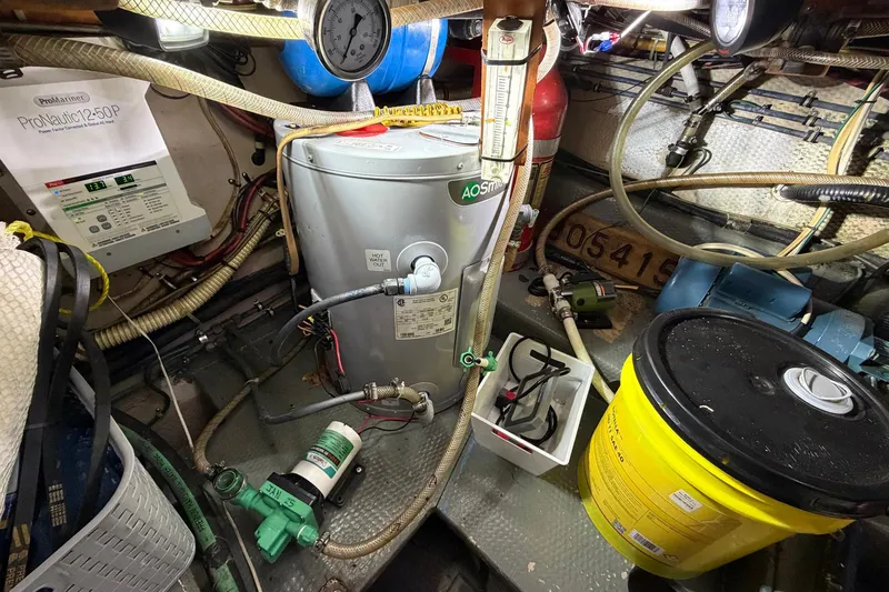 Slide: The Image of Engine room of 1987 Viking 44 Motor Yacht with equipment and wiring. - 77