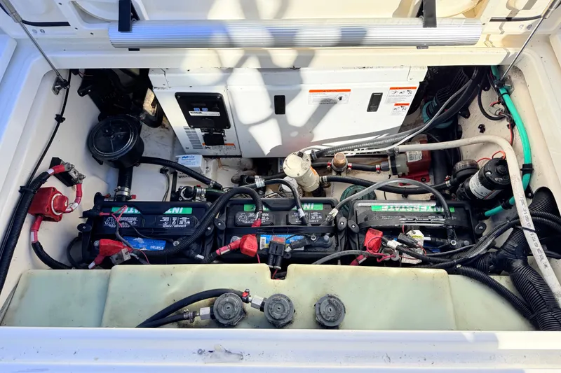 Slide: The Image of Engine compartment of a 2012 Boston Whaler 285 Conquest with batteries and wiring. - 27