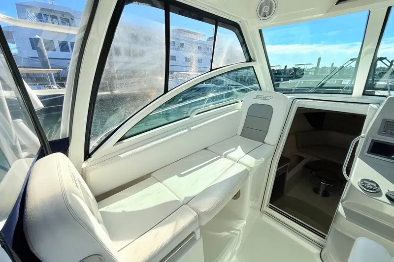 Slide: The Image of Interior of 2012 Boston Whaler 285 Conquest boat, featuring comfortable seating and modern design. - 15