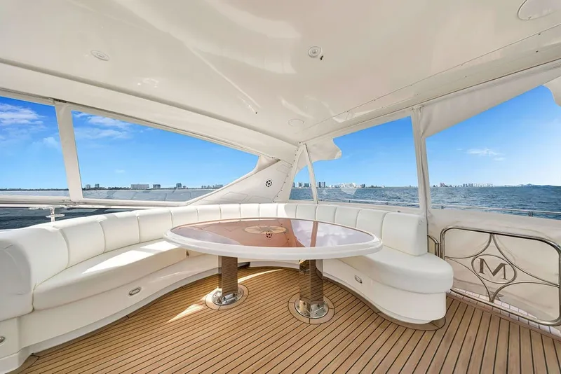 Slide: The Image of Luxurious 2007 Marquis 65 yacht interior with elegant seating and ocean view. - 18