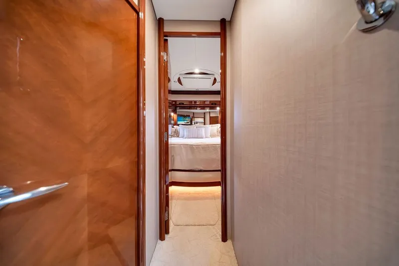Slide: The Image of Luxurious interior hallway of a 2007 Marquis 65 yacht leading to a cozy bedroom. - 49