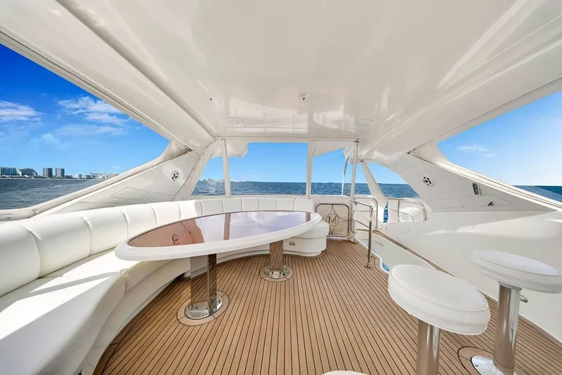 Slide: The Image of Luxurious 2007 Marquis 65 yacht interior with elegant seating and ocean view. - 19