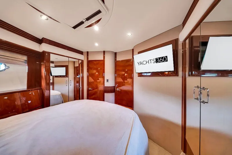 Slide: The Image of Luxurious interior of a 2007 Marquis 65 yacht with elegant wood finishes and modern amenities. - 53