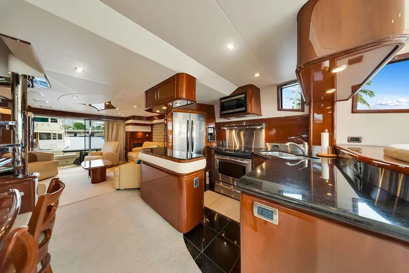 Slide: The Image of Luxurious interior of a 2007 Marquis 65 yacht featuring modern kitchen and comfortable seating. - 29