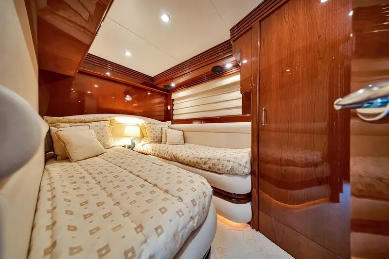 Slide: The Image of Luxurious cabin interior of a 2007 Marquis 65 yacht with elegant wood finishes. - 60