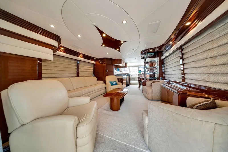 Slide: The Image of Luxurious interior of a 2007 Marquis 65 yacht with elegant seating and wood accents. - 24