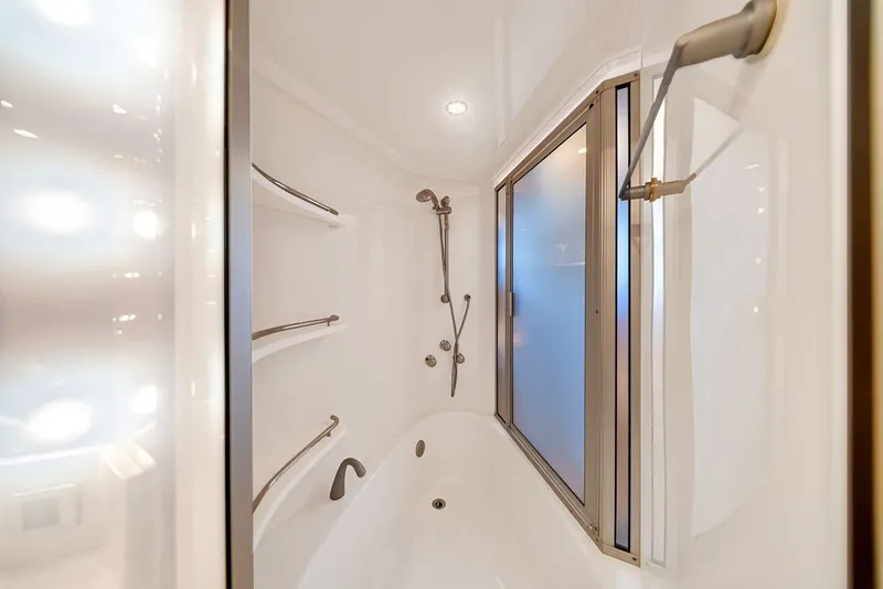 Slide: The Image of Luxurious bathroom in 2007 Marquis 65 yacht with modern shower and sleek design. - 46