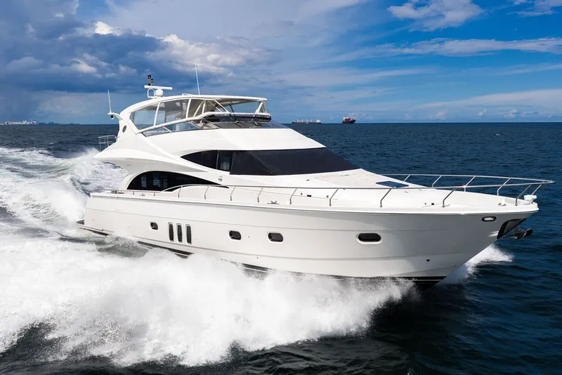 The Image of Luxury 2007 Marquis 65 yacht cruising on open sea under clear skies. - 0