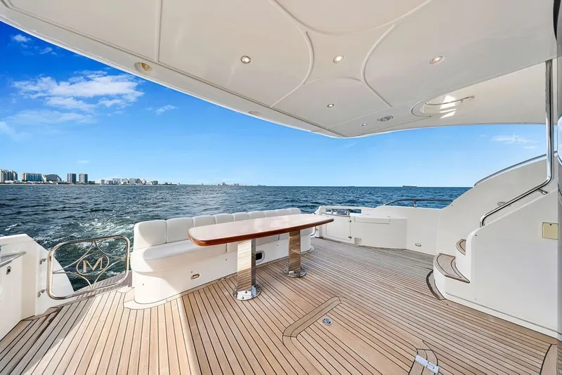 Slide: The Image of Luxurious 2007 Marquis 65 yacht deck with ocean view and elegant seating area. - 15