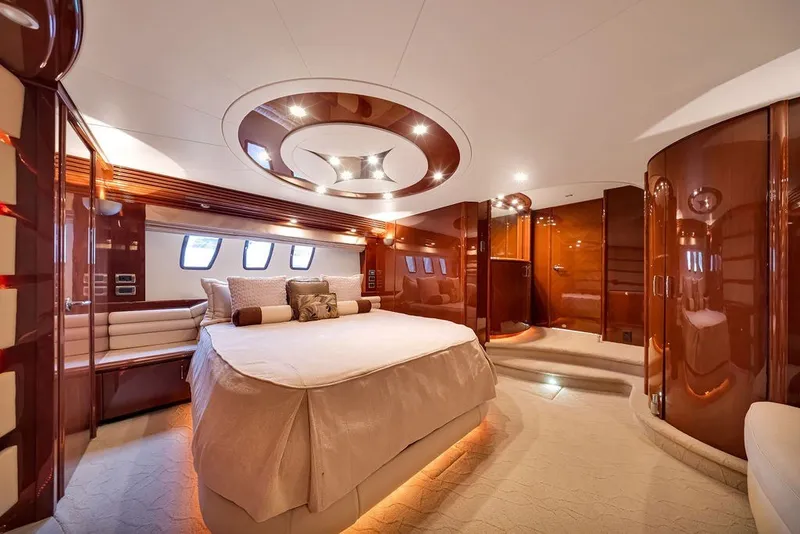 Slide: The Image of Luxurious interior of 2007 Marquis 65 yacht with elegant wood finishes and plush bedding. - 38