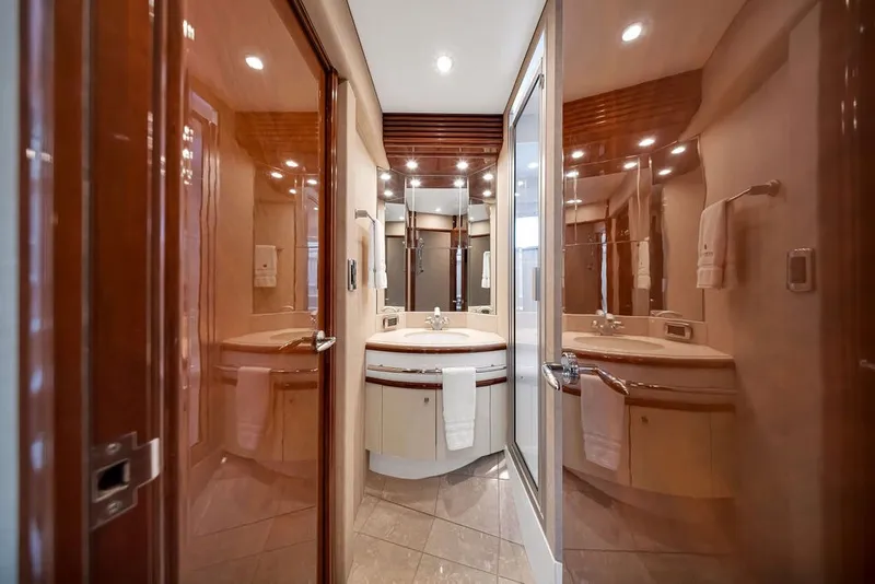 Slide: The Image of Luxurious bathroom interior of a 2007 Marquis 65 yacht with elegant wood finishes. - 62