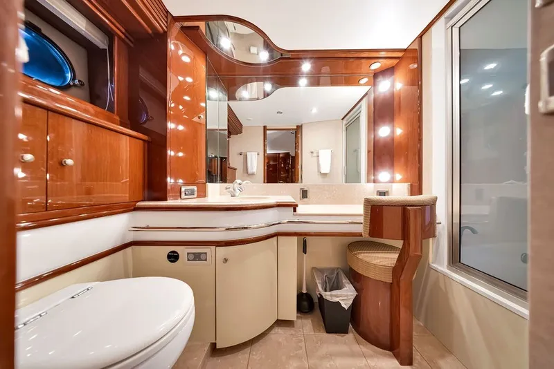 Slide: The Image of Luxurious bathroom interior of a 2007 Marquis 65 yacht with elegant wood finishes. - 43