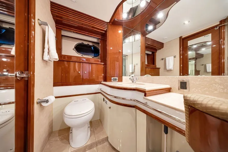 Slide: The Image of Luxurious bathroom in a 2007 Marquis 65 yacht with elegant wood finishes and modern fixtures. - 44