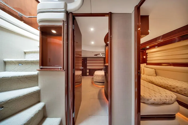Slide: The Image of Luxurious interior of a 2007 Marquis 65 yacht featuring elegant bedrooms and plush carpeting. - 32