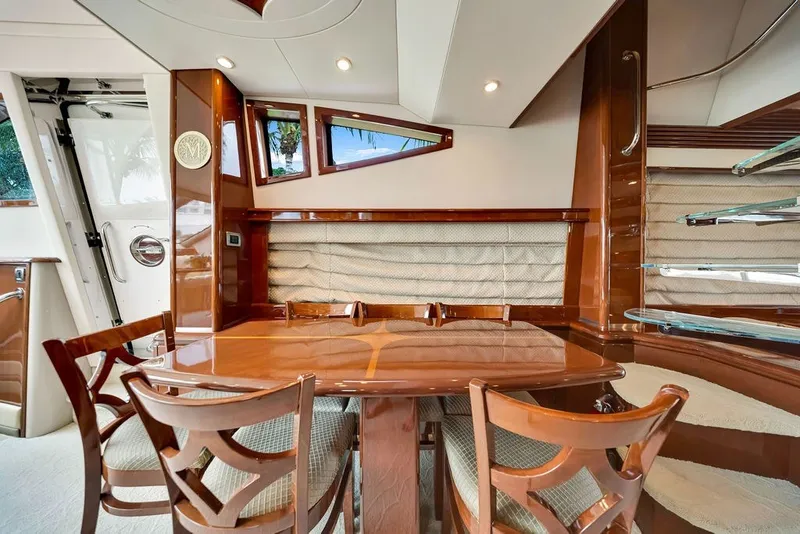 Slide: The Image of Luxurious interior of a 2007 Marquis 65 yacht with elegant wood finishes and seating area. - 28
