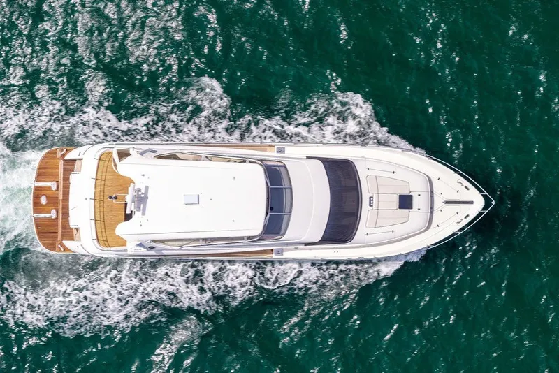 Slide: The Image of Aerial view of 2007 Marquis 65 yacht cruising on vibrant blue ocean waters. - 7