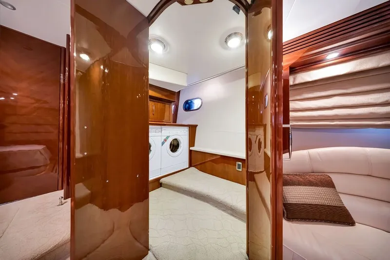 Slide: The Image of Luxurious interior of 2007 Marquis 65 yacht with washer, dryer, and elegant wood finishes. - 41