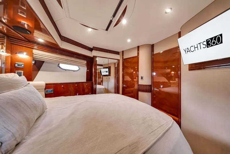 Slide: The Image of Luxurious interior of a 2007 Marquis 65 yacht with elegant wood finishes and modern lighting. - 54