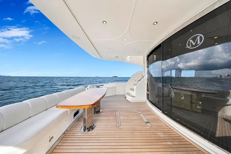 Slide: The Image of Luxurious 2007 Marquis 65 yacht deck with ocean view and elegant seating area. - 16