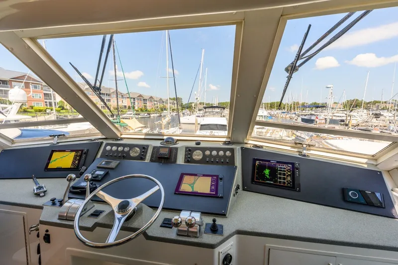 Slide: The Image of Cockpit view of 1999 Viking 60 Cockpit Motor Yacht with navigation instruments. - 8
