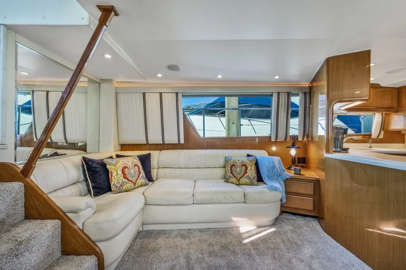 Slide: The Image of Luxurious interior of 1999 Viking 60 Cockpit Motor Yacht with plush seating and elegant decor. - 18