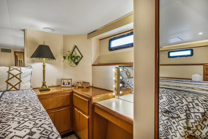 Slide: The Image of Luxurious cabin interior of 1999 Viking 60 Cockpit Motor Yacht with elegant decor. - 30