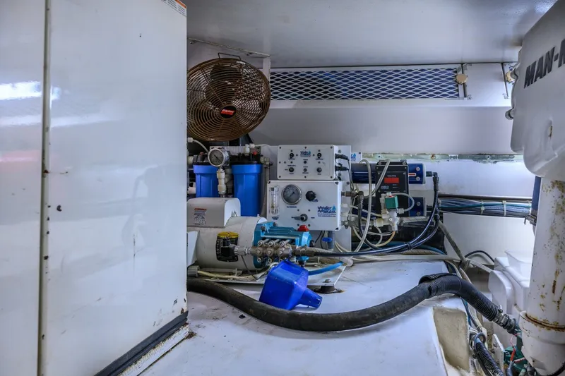 Slide: The Image of Engine room of 1999 Viking 60 Cockpit Motor Yacht with mechanical equipment and wiring. - 42