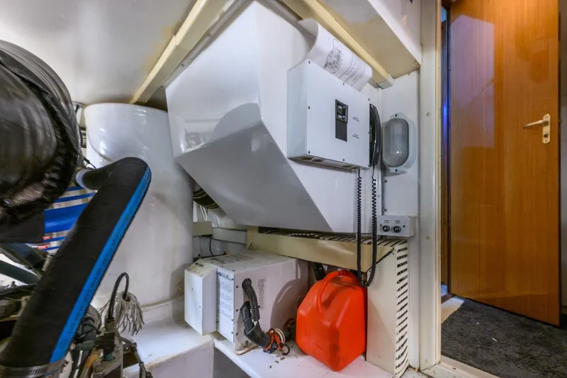 Slide: The Image of Engine room of 1999 Viking 60 Cockpit Motor Yacht with equipment and storage. - 41
