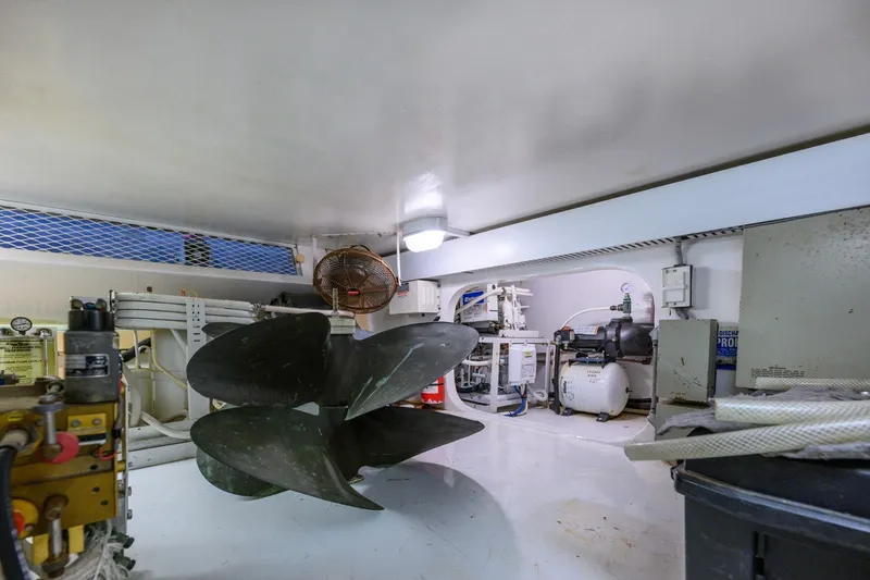 Slide: The Image of Engine room of 1999 Viking 60 Cockpit Motor Yacht with propeller and machinery. - 44