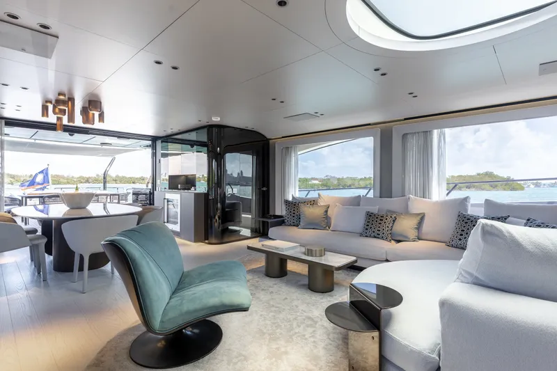 Slide: The Image of Luxurious interior of 2024 Mangusta 104 REV yacht with modern furnishings and scenic views. - 2